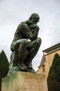 Statue `The Thinker` at the gardens of the Rodin Museum in Paris.